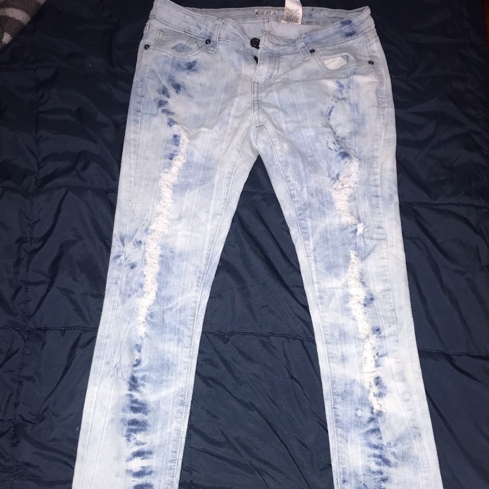 Light colored ripped jeans